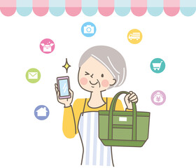 スマートフォンでオンラインショッピングをするシニア女性