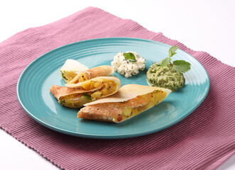 masala dosa with coconut chutney and mint chutney.
South Indian food.