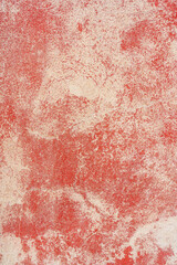 Red plaster texture. The rough surface of the wall of an old house.