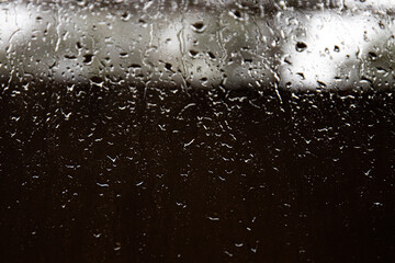 Rain drops on the Window at Night time