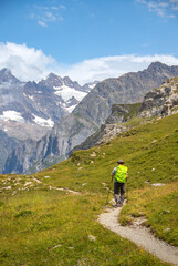 man hiking in the swiss mountains