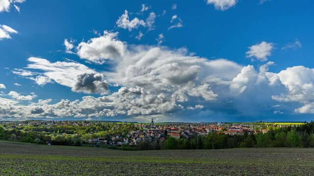 Timelapse of rainy clouds passing over Czech town Stribro