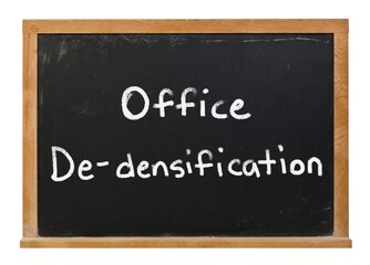 Office de-densification written in white chalk on a black chalkboard isolated on white