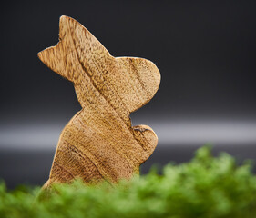 Wooden easter bunny in green grass