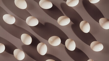 White eggs are scattered on a gray background, lots of chicken eggs with rough shadows