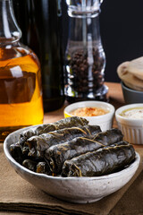 .Dolma, Sarma or Turkish Dolmades. Traditional Mediterranean dish Dolmadakia or Tolma. Stuffed grape leaves.