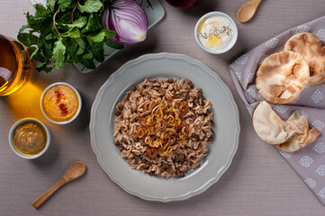 Mujaddara. Rice with lentil a vegetarian dish of Arabic cuisine. Top view