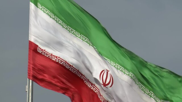 Waving Iranian flag in Tehran, Iran