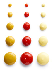 Ketchup mayonnaise and mustard isolated on white, from above