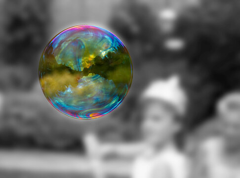 A perfect bubble captured in colour isolation. Black and white background