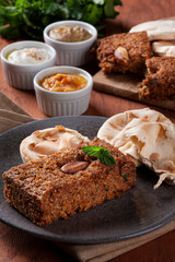 .Baked kebab with side dishes, hummus, babaganoush, curd and pita bread. Arabic food.