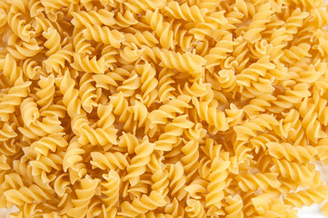 background, twisted pasta close-up top view