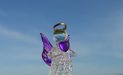 Funny figurine. A funny figurine in the shape of an angel. Angel with a heart.
