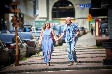 Senior couple walking around old town