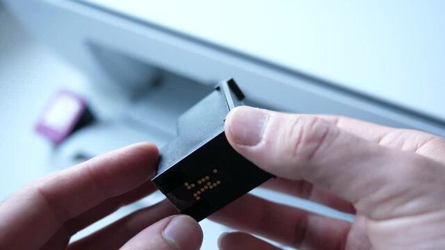 Holding an ink cartridge of an ink jet printer.