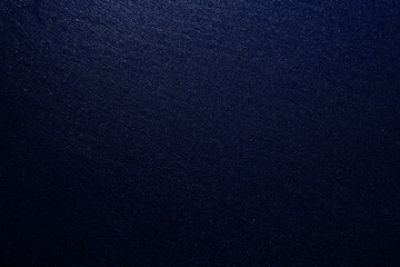 Dark sand texture. Sandy beach background. Top view