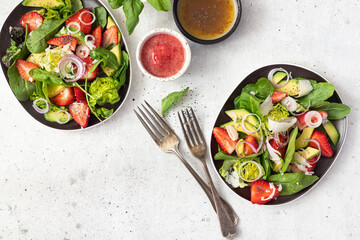 Summer salad with strawberries, avocado and poppy seeds. Healthy food.