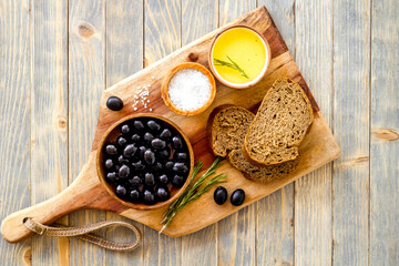 Italian food with olives bread and olive oil. Overhead view