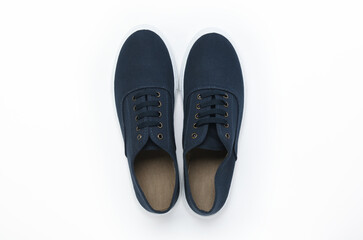 Blue pair of sneakers on a white background. View from above. 