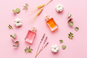Floral flat lay with perfume bottle, top view