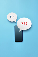 The phone and the question and exclamation mark icons above it. Symbol of questions and search for...