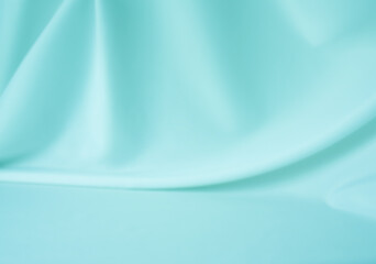 Smooth elegant light blue silk or satin texture can use as abstract background. Luxurious background design