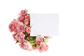 Obraz na płótnie Canvas Pink roses framework on white background. Flat lay.