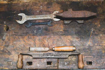 old rusty tools on wood