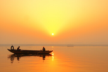 Naklejka na ściany i meble February 02, 2020 Varanasi, India Sunrise view of gangas River in morning at ganga ghat in Varanasi