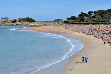 People walking on a beach in Brittany