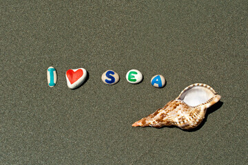 Phrase I love Sea on beach sand 