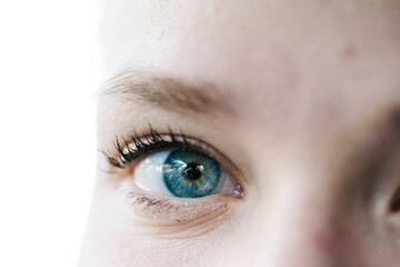 blue eye of a beautiful woman wearing contact lens