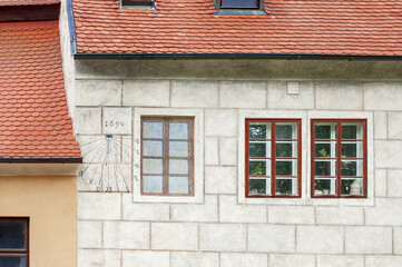 sundial on a cozy streets little town of Cesky Krumlov in the Renaissance Baroque style