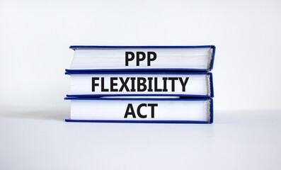PPP, paycheck protection program flexibility act symbol. Concept words PPP flexibility act on books on a beautiful white background. Business, PPP paycheck protection program flexibility act concept.