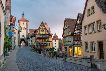 Fototapeta na wymiar ROTHENBURG OB DER TAUBER, GERMANY, 26 JULY 2020 Colorful half-timbered houses in the street of the historic center