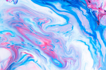 Fluid art. Abstract lilac pink background. Liquid marble texture design. Blue pink pattern
