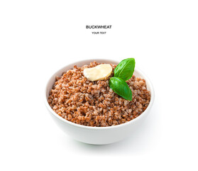 Boiled buckwheat with butter and basil close-up isolated on white.