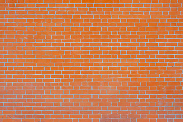 Brick wall made of old, red brick.