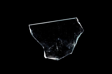 glass fragment isolated on a black background. Broken window