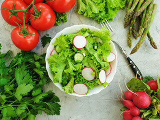 radish salad, cucumbers on a concrete background