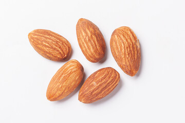 five nuts - almond kernel isolated on white background
