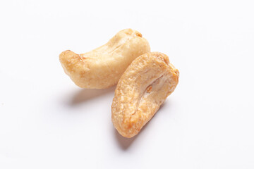 two nut kernels - cashew isolated on white background, close up