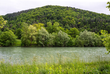 Scenic landscape of hills. View of he Savinja river with rural surroundings in Celje. Celje is the third-largest town in Slovenia.