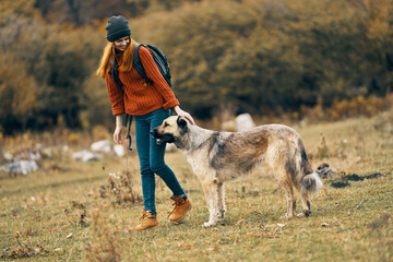 woman hiker walking the dog outdoors in the forest freedom travel