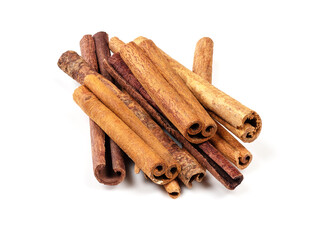 pile of chinese cinnamon (Cassia) rools on white