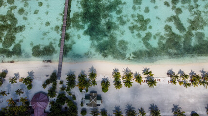 Maldives resort island drone aerial view, Indian ocean atoll nature beach and palm forest, leisure...