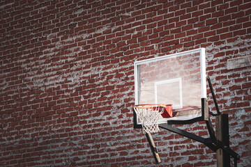Urban basketball hoop with brick wall