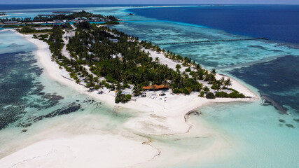 Maldives resort island drone aerial view, Indian ocean atoll nature beach and palm forest, leisure tourist luxury vacation