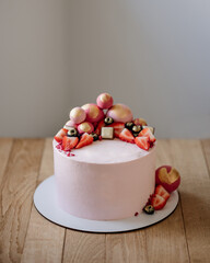 Pink tasty dessert on white background. Sweet dessert for celebration.