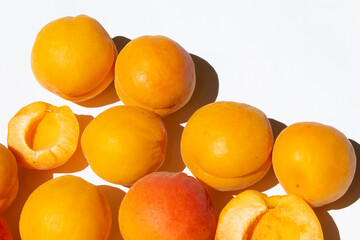 Sweet fresh apricots fruit on white background top view